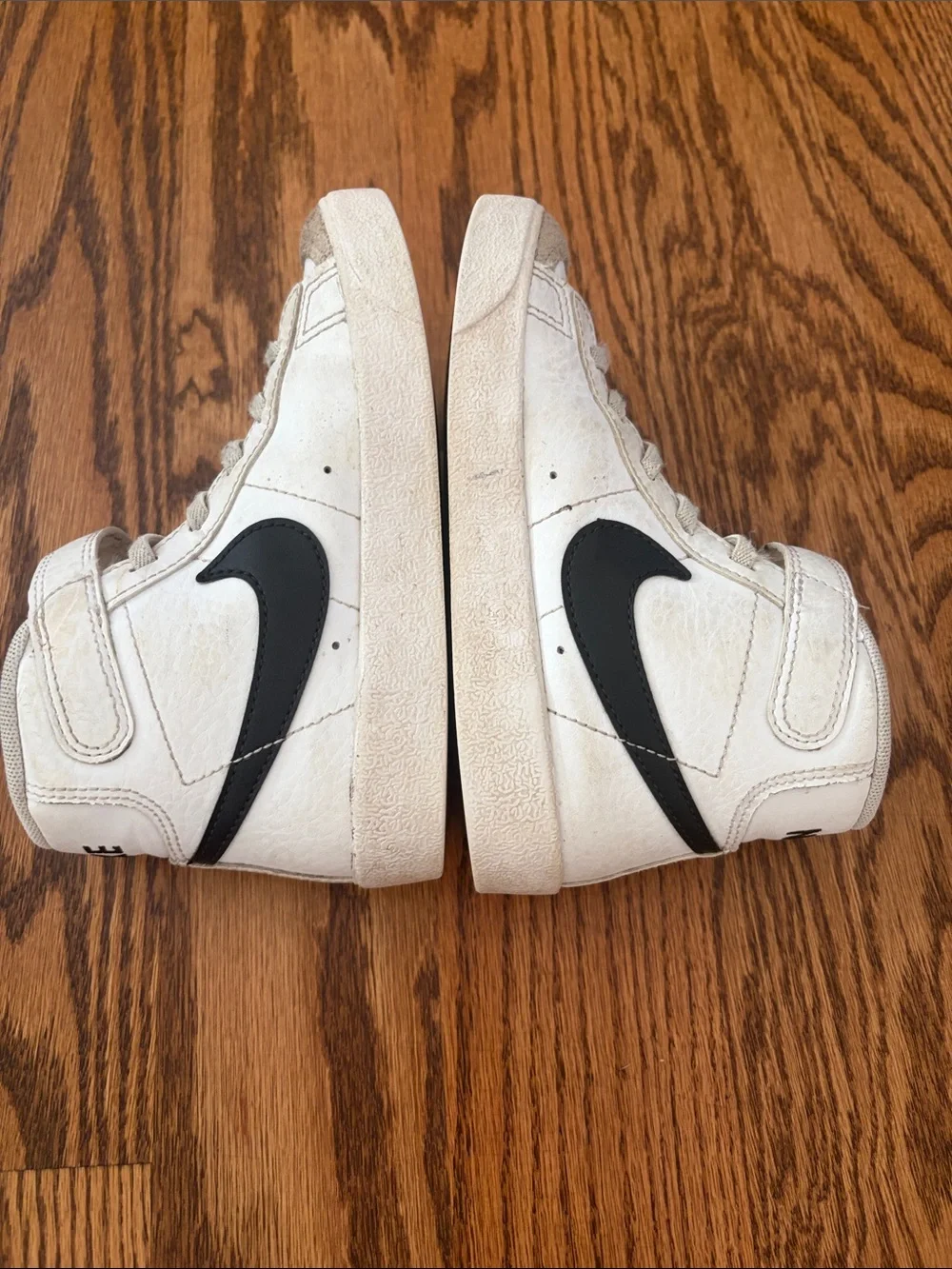 Nike Kids High-Top Sneakers in White with Black Swoosh